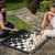 Traditional Garden Games Garden Chess laid out with 2 people playing in the garden