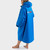 Person standing wearing the Dryrobe Advance Adults Cobalt Long Sleeve Outdoor Robe  facing away