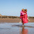 Children on the beach playing wearing dryrobe kids towel robes