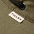 Close up of the logo tab on the Tilley Ultralight T5 Olive Hat