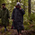 Person wearing the Red Paddle Co Pro Change EVO Grey Long Sleeve Outdoor Robe on a walk in the woods