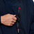 Close up of outer unzipped pocket Red Paddle Co Pro Change EVO Navy Long Sleeve Outdoor Robe with car keys being put in the pocket