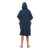 Child wearing the Red Paddle Kids Quick Dry Navy Change Robe facing away from the camera with the hood up and hands in the front pockets