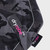 Close up of the Dryrobe Black Camo & Pink Dog Coat showing the black camo design and dryrobe logo strap