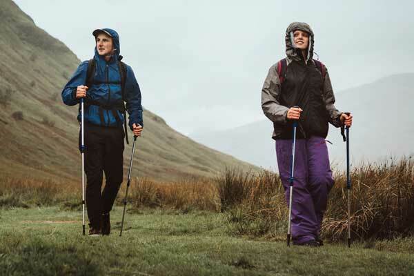 Two people walking with full outdoor kit