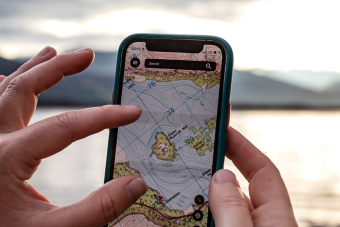 A person using OS Maps on a phone to view a map