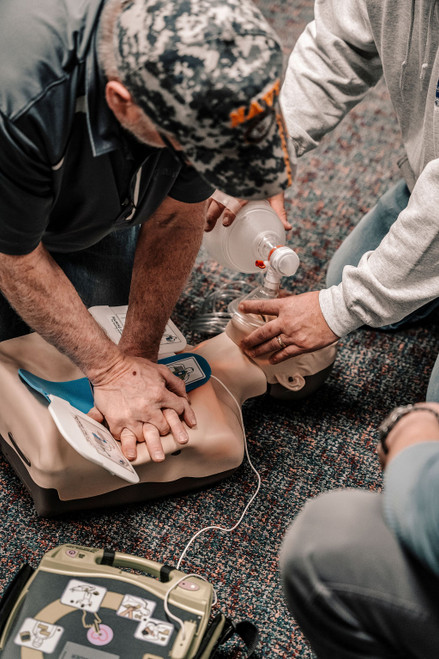 Advanced life-saving skills training for the prepared citizen: Students performing team-based BLS resuscitation with AED and bag valve mask at 1791 TAT training facility.