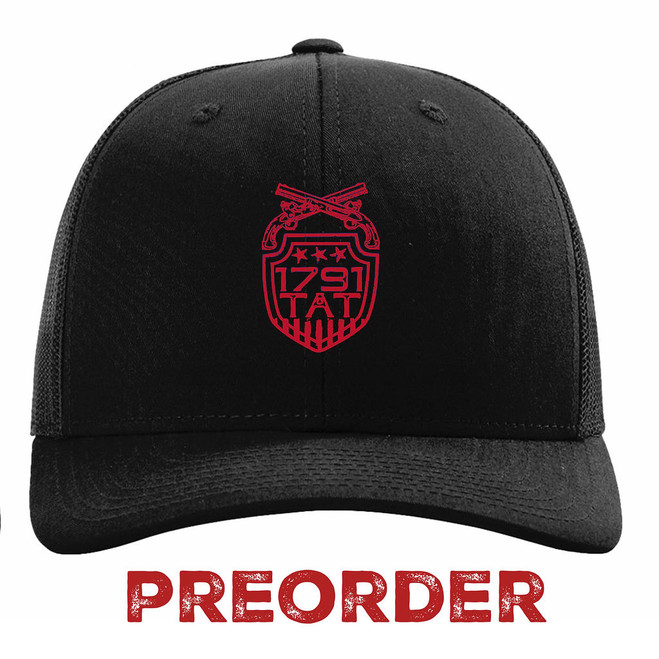 Black 1791 TAT Trucker Hat with red shield logo. Tactical-style headwear for firearms training and community recognition.
