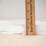Measuring thickness of mattress pad