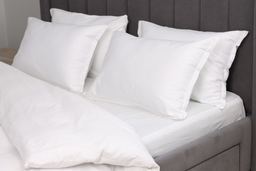 White Heritage cotton percale pillowcases on bed