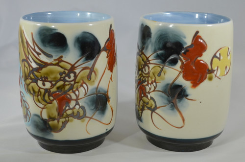 View of dragon heads on front of cups.