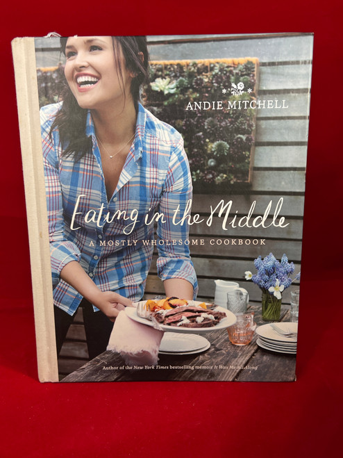 Cover of the first edition cookbook - Eating In The Middle A Mostly Wholesome Cookbook by Andie Mitchell.