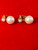 Vintage Faux Double Pearl Drop Earrings lying on felt highlighting their double drop pearl design.