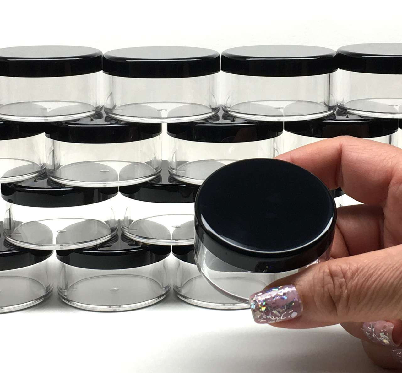 https://cdn11.bigcommerce.com/s-qd7k5gxi/images/stencil/1280x1280/products/252/6365/Cosmetic-Jars-Plastic-Beauty-Containers-30-Gram-Black-Clear-Lid_3853__19559.1660975701.jpg?c=2?imbypass=on