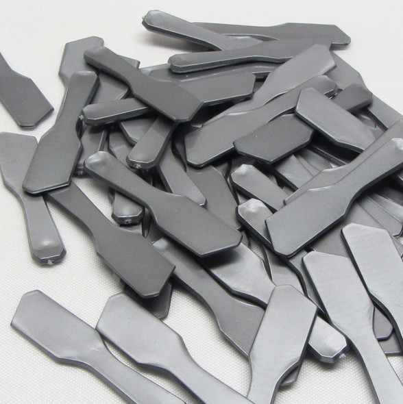 A bunch of grey mini Cosmetic Spatulas Makeup Mixing Tool scattered