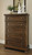 Flynnter Medium Brown 7 Pc. Dresser, Mirror, Chest, Queen Sleigh Storage Bed & Nightstand
