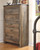 Trinell Brown 8 Pc. Dresser with Fireplace Option, Mirror, Chest, King Poster Bed & Nightstand