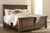 Flynnter Medium Brown King Sleigh Storage Bed