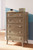 Aprilyn Light Brown Five Drawer Chest