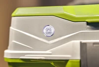 A Lost and Found Label on a green and beige toolbox.