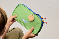 Life360 Tile - Clay on a green pencil pouch