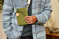 Image of Tile - Clay on green bag