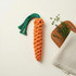 Carrot-shaped dog rope toy handmade from recycled cotton