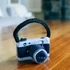 P.L.A.Y. Globetrotter mini camera dog toy with hidden squeaker