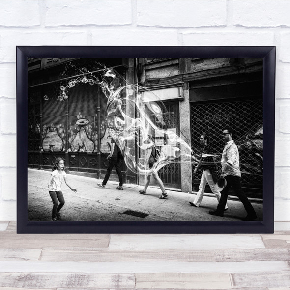 Magic Bubbles in street kid playing Black and white Wall Art Print