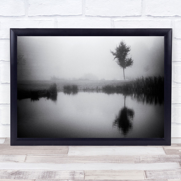 Lonely tree by lake reflection black and white Wall Art Print