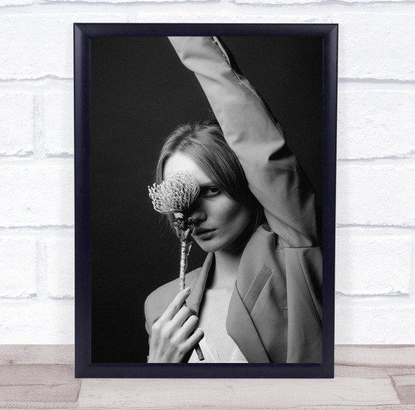 woman in blazer arm in the air flower in face Wall Art Print
