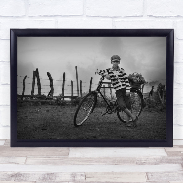 A Boy on a bike black and white striped Wall Art Print