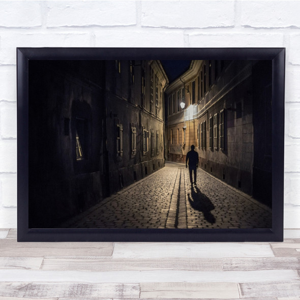 Path man shadow buildings Night time Wall Art Print