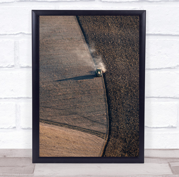 Tractor harvesting field aerial view Wall Art Print