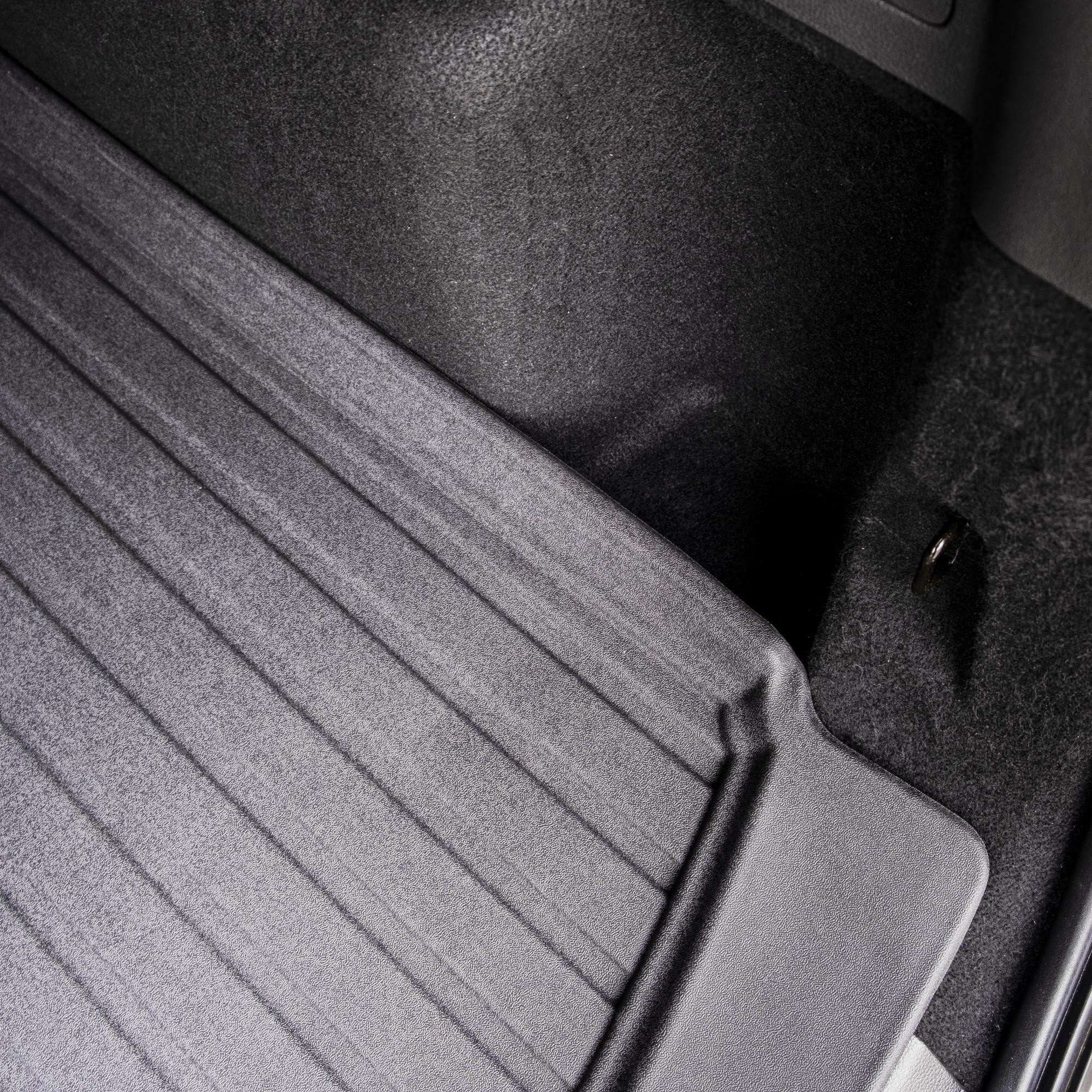 Front corner edge of DriveDen boot mat showing raised lip for Ford Kuga Mk.2 boot