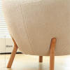 Henrik Wooden Lounge Chair feature 1 — natural wood + padded seat