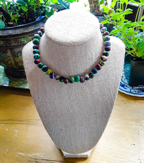 Handmade clay beaded choker set on an elasticband, finished with a lobster claw for easy open and closure. One size fits most. Each beaded choker is unique. The pictured choker is for display only.
