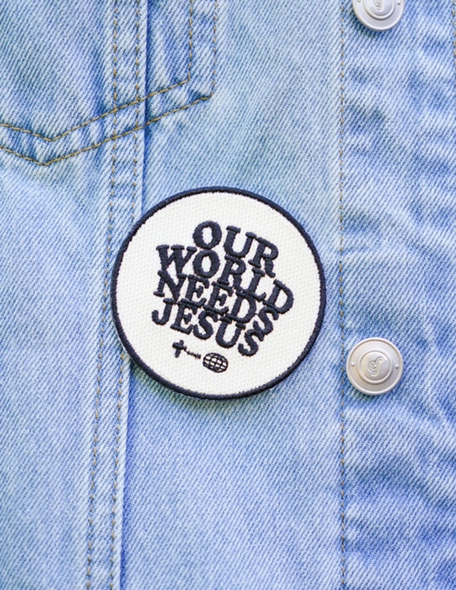 Our World Needs Jesus Iron On Patch