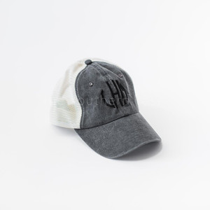 A gray and white trucker hat with black monogrammed letters.