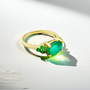 Unique women’s ring featuring oval emerald in yellow gold