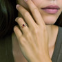 red spinel vintage engagement ring on models hand