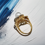 Pearl ring with sapphire accents in timeless vintage design