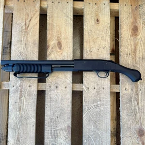 Mossberg 590S Shockwave 12 gauge pump action firearm with 14.375 inch barrel and Shockwave grip, in store image