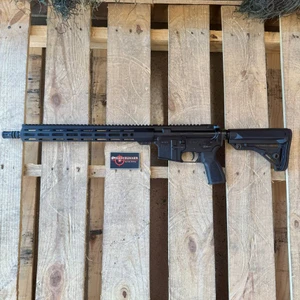 One Horse Express 16-inch AR-15 rifle chambered in 5.56 NATO featuring a 15-inch M-LOK handguard, THRiL stock and grip, and SOCOM-profile barrel, in store image