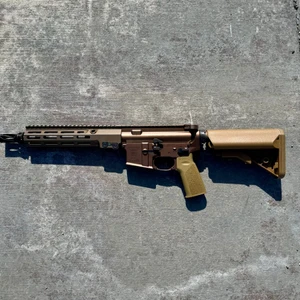 Geissele Super Duty MOD1 10.3 inch SBR in Desert Dirt Color chambered in 5.56 NATO with MK16 rail and HUXWRX flash hider, in store image