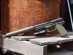 HK Mark 23 OD Green 45 ACP with custom color-matched OD Green Rugged Obsidian 45 suppressor and SureFire X300 Turbo.
