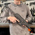 Springfield Armory Kuna 9mm PCC pistol with 6 inch threaded barrel, M-LOK handguard and folding brace in black, in store held