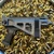 Grand Power Stribog SP9A3S 9mm pistol with folding brace, threaded barrel, and M-LOK handguard, in store image folded stock facing right