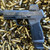 Sig Sauer P365 X Macro 9mm pistol with 4.3 inch threaded barrel, Romeo X optic, and black finish on ammo casings pointing to the left