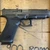 Glock 17 Gen 6 MOS full size 9mm pistol with optics ready slide and 17 round magazine pointing to the right, in store image